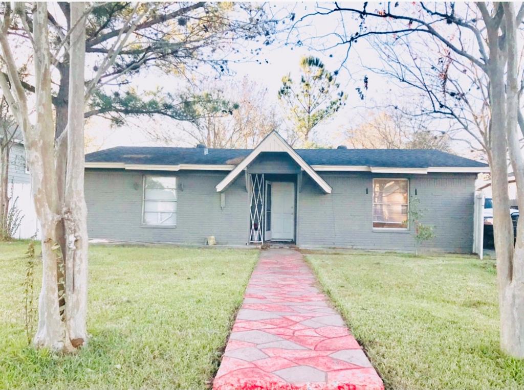 a front view of a house with yard