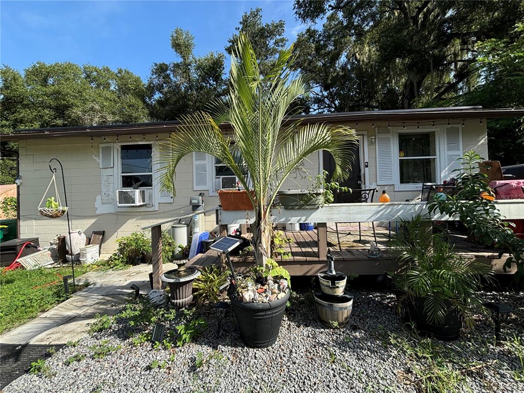 a front view of a house with outdoor seating