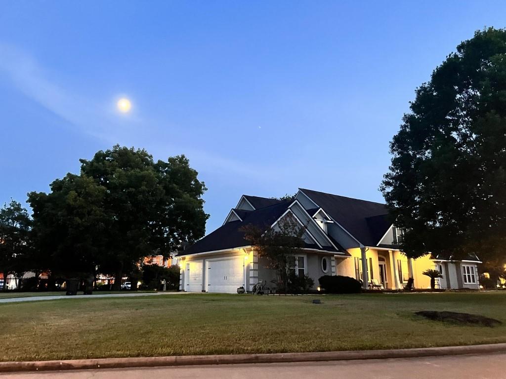 a view of a big house in middle of the town