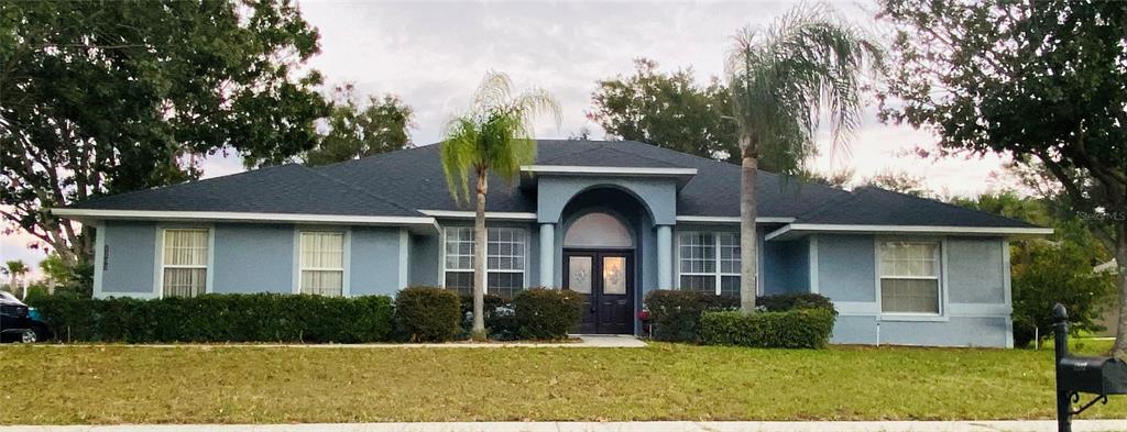 a front view of a house with a yard