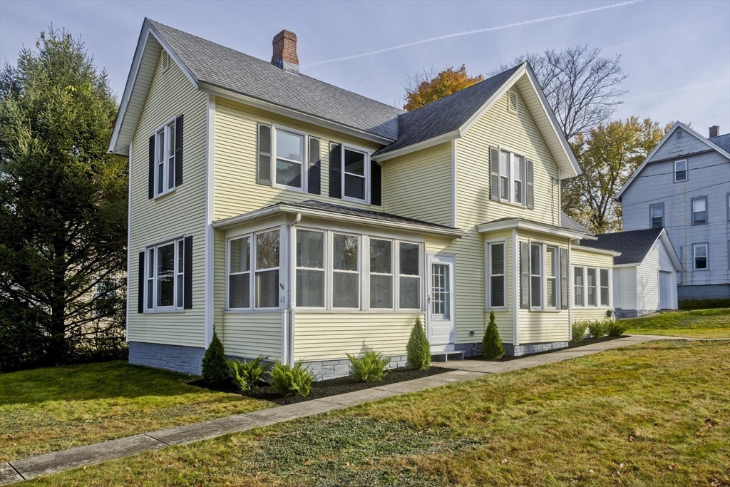 a front view of a house with a yard