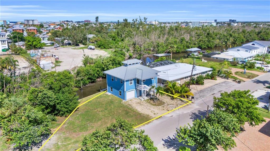 an aerial view of a house with big yard