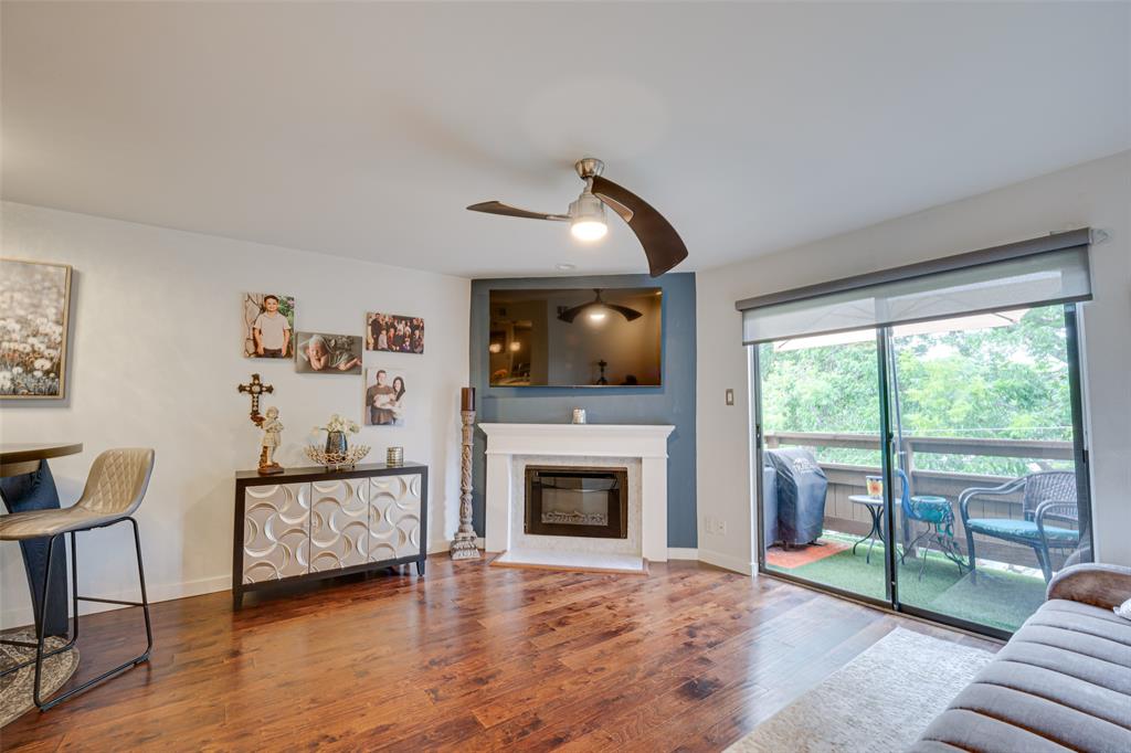 a living room with furniture fireplace and flat screen tv