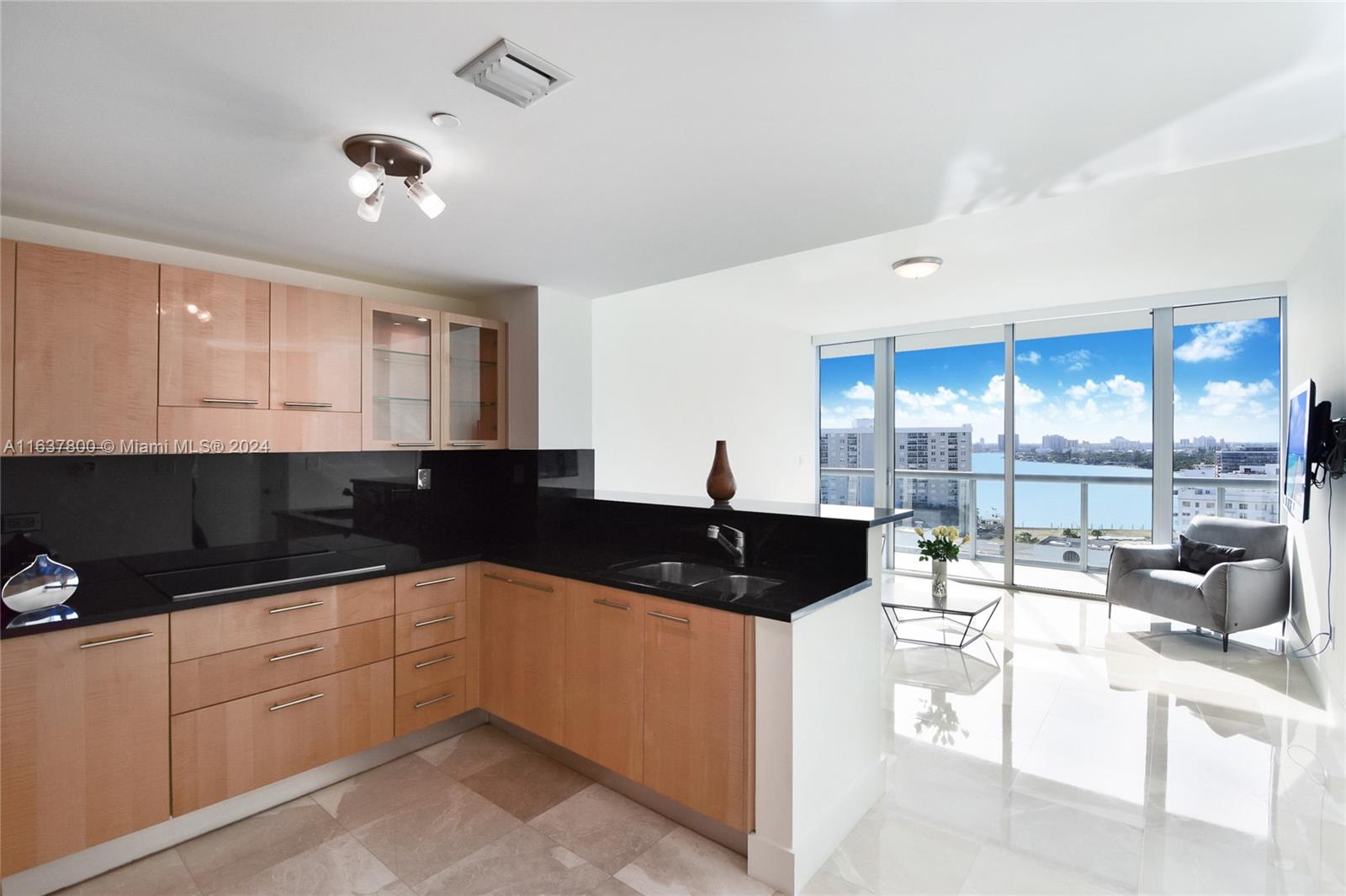 a kitchen with a sink and large cabinets