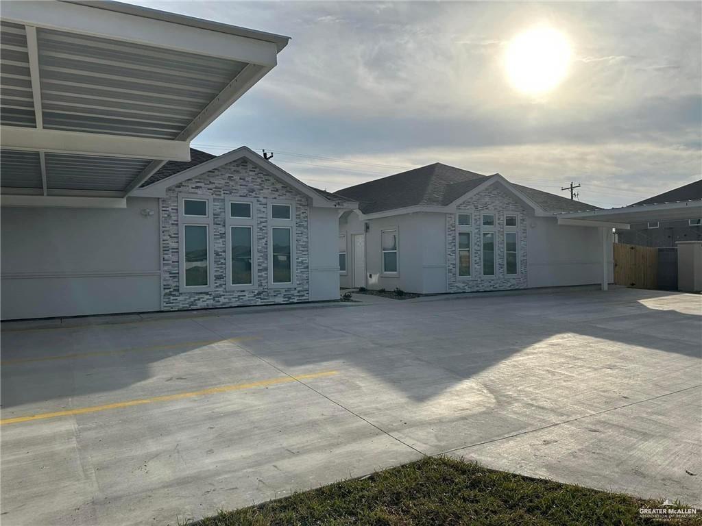 a view of large house with a garage