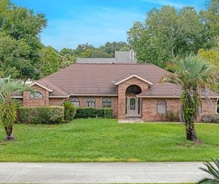 a aerial view of a house with a yard