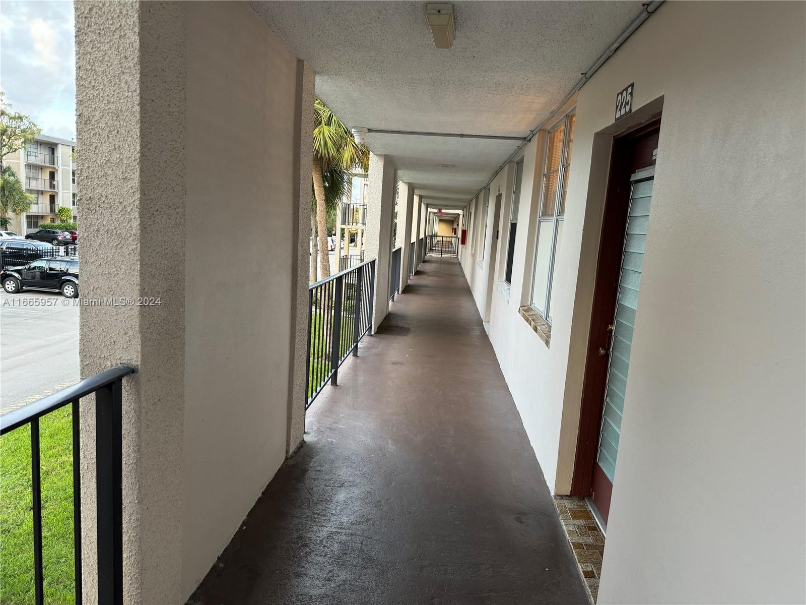 a view of a hallway with windows