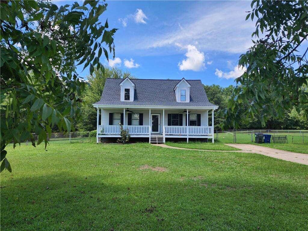 a view of a house with a big yard