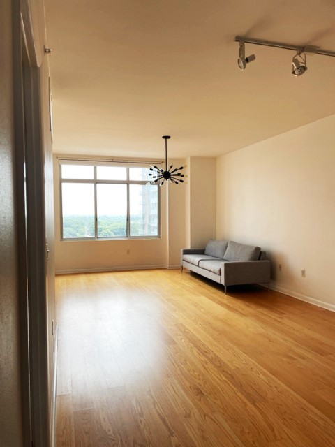 a view of an empty room with a window