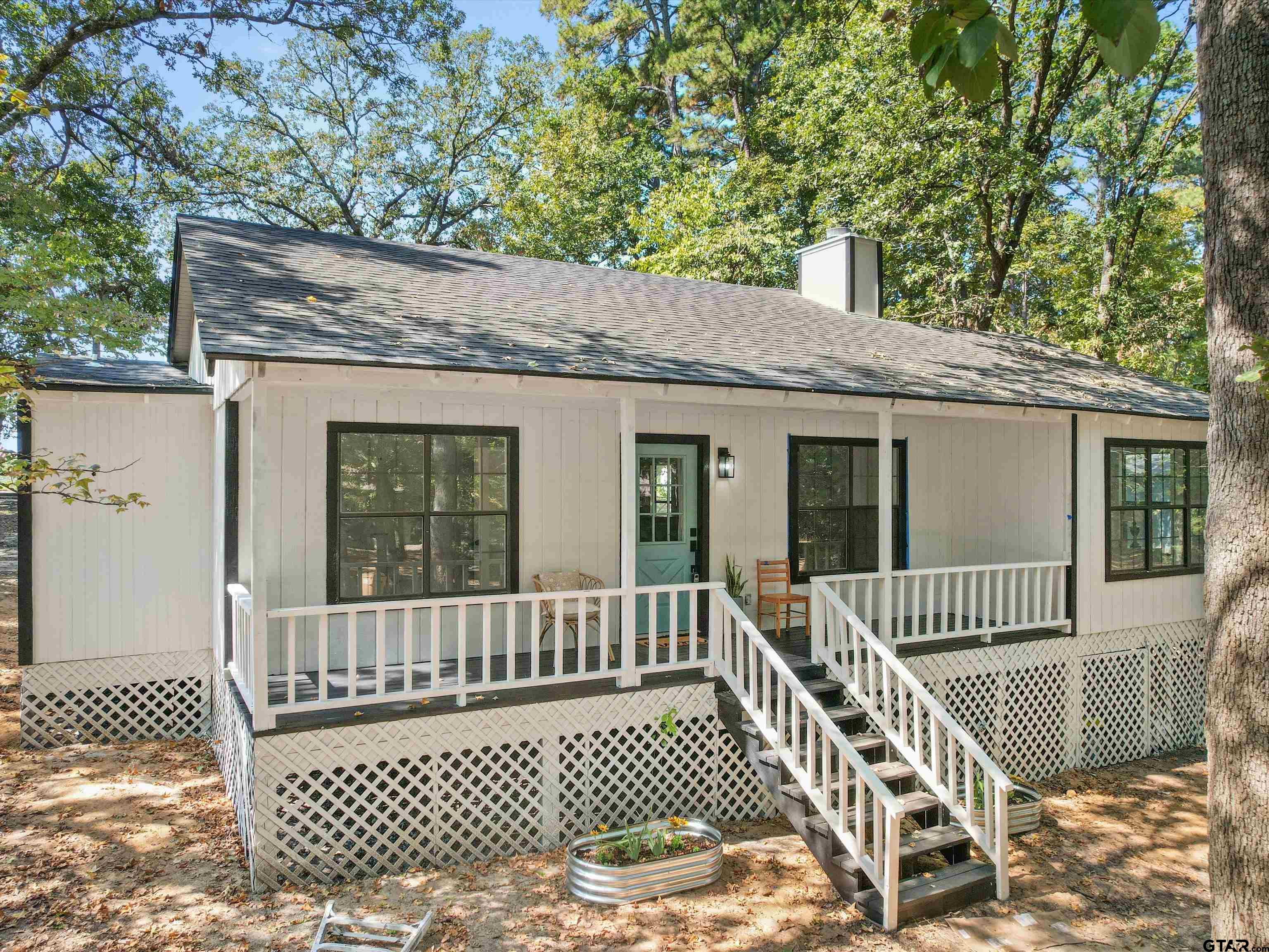 a view of a deck with a wooden fence