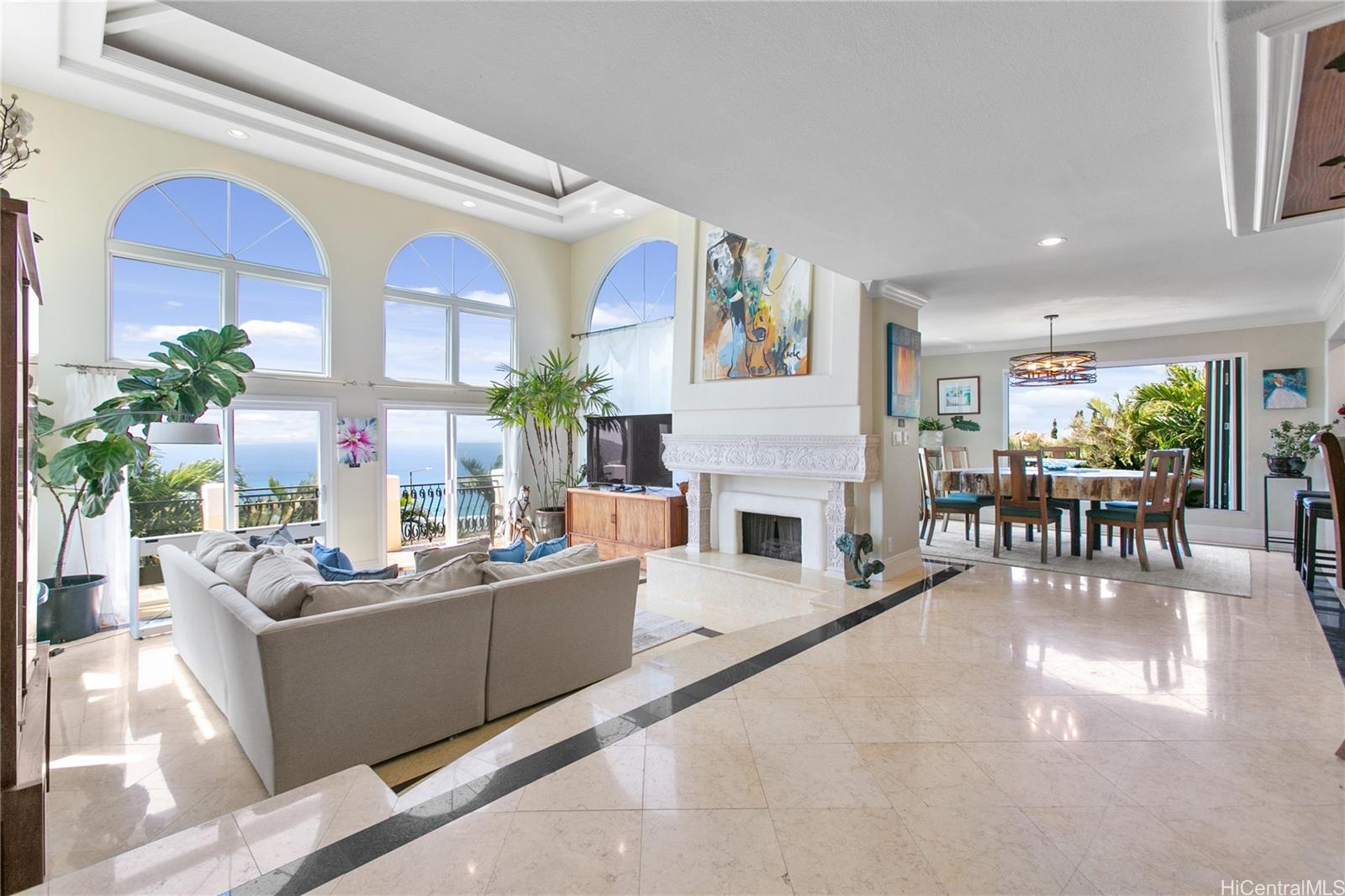 a living room with furniture a fireplace and a table