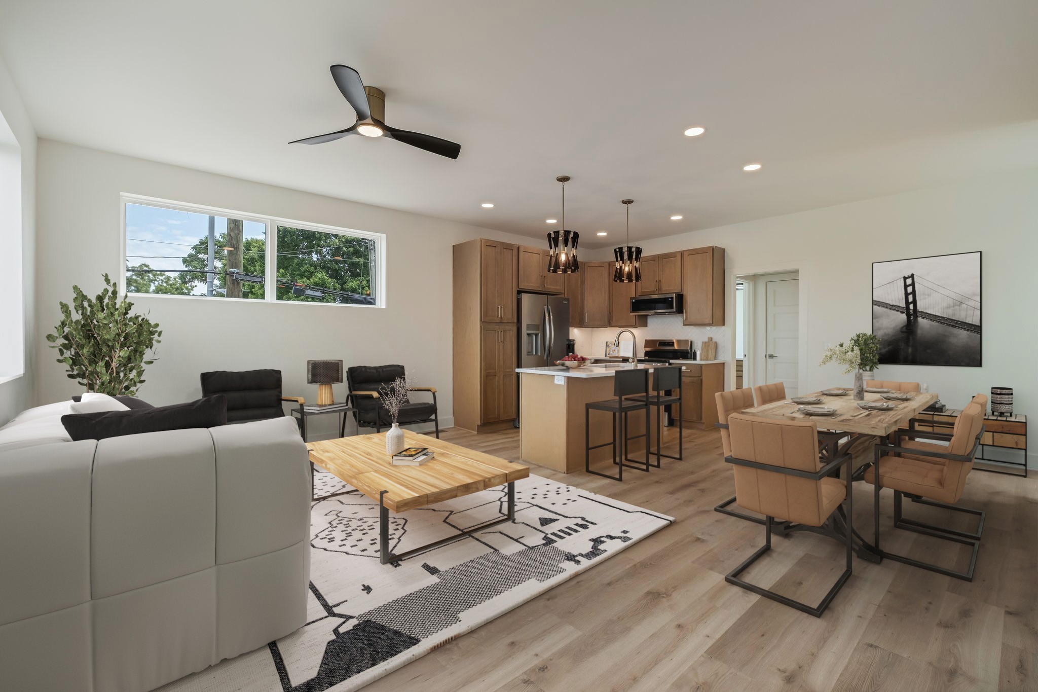 a living room with furniture and kitchen view