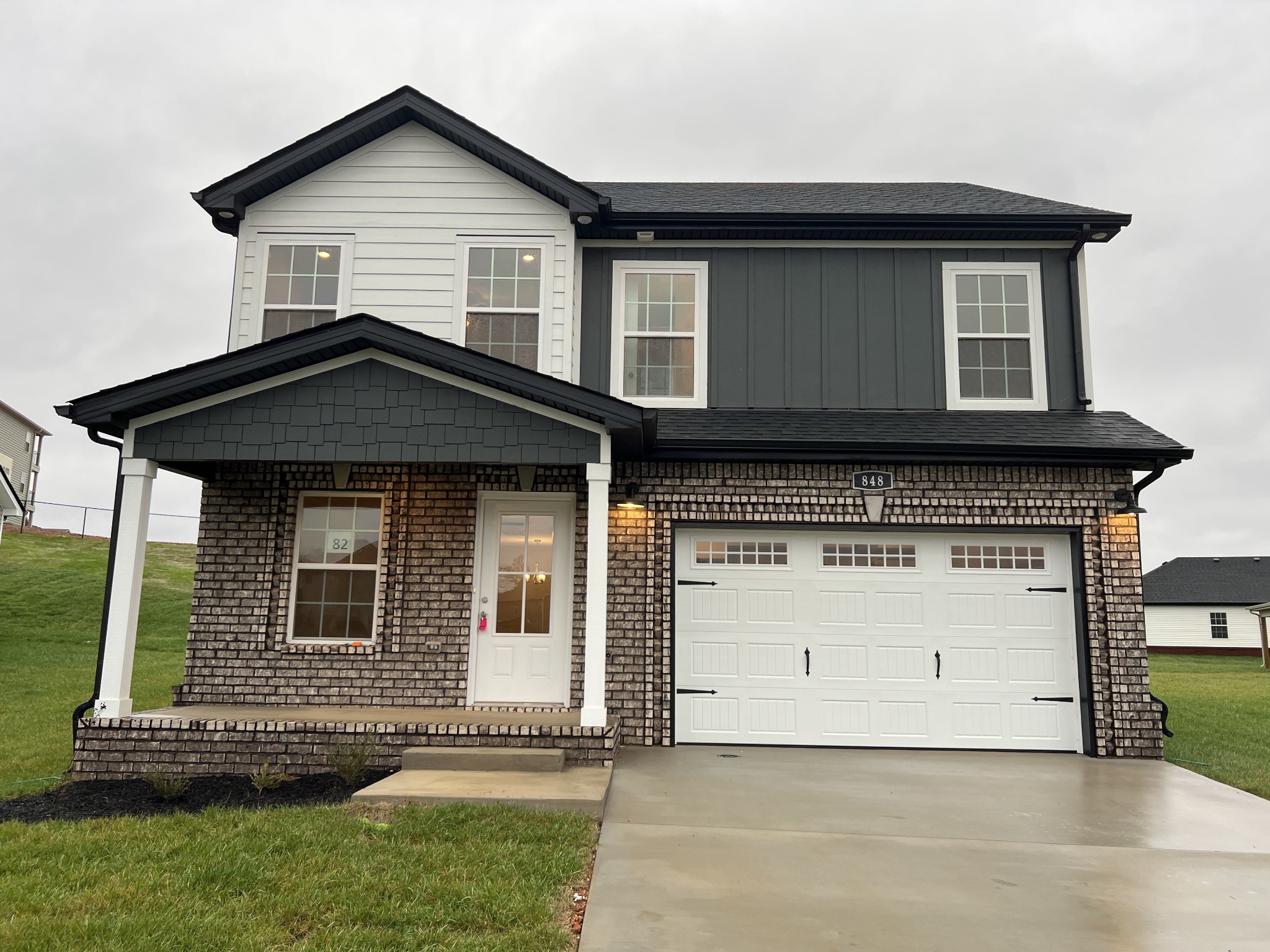 a front view of a house with a yard