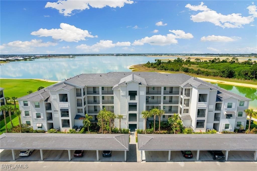 a front view of a building with lake view and mountain view