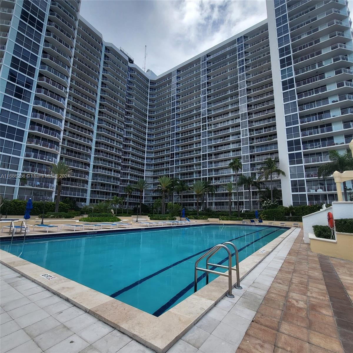 a view of swimming pool with chairs