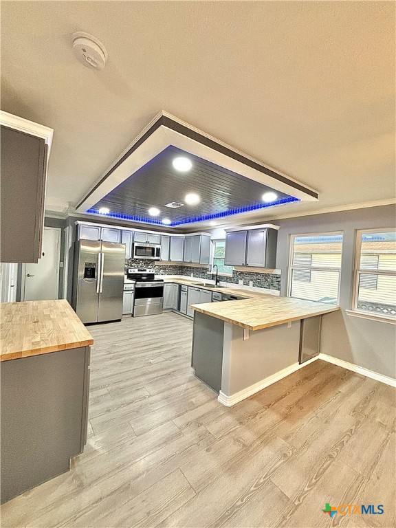 a large kitchen with stainless steel appliances kitchen island granite countertop a large counter top and stove