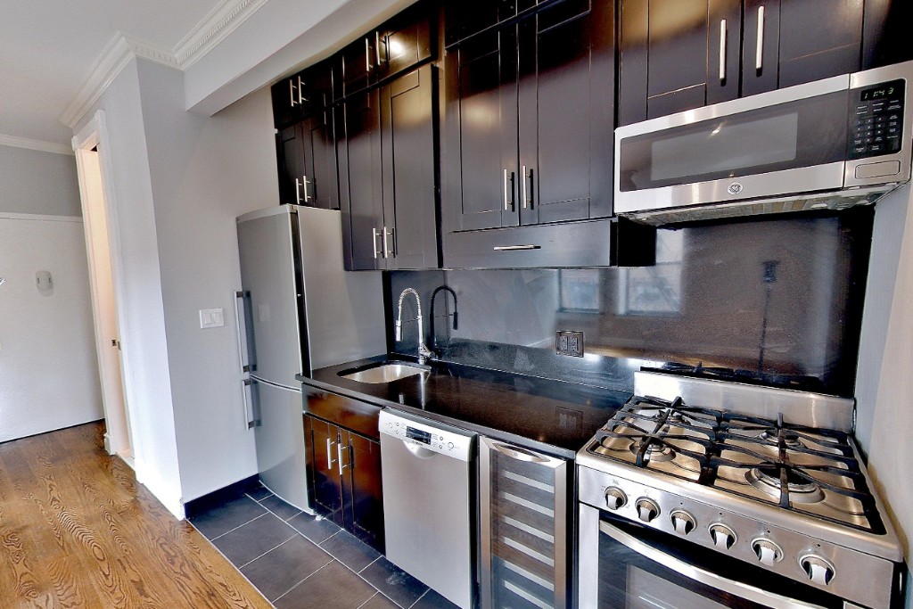 a kitchen with a stove and a refrigerator