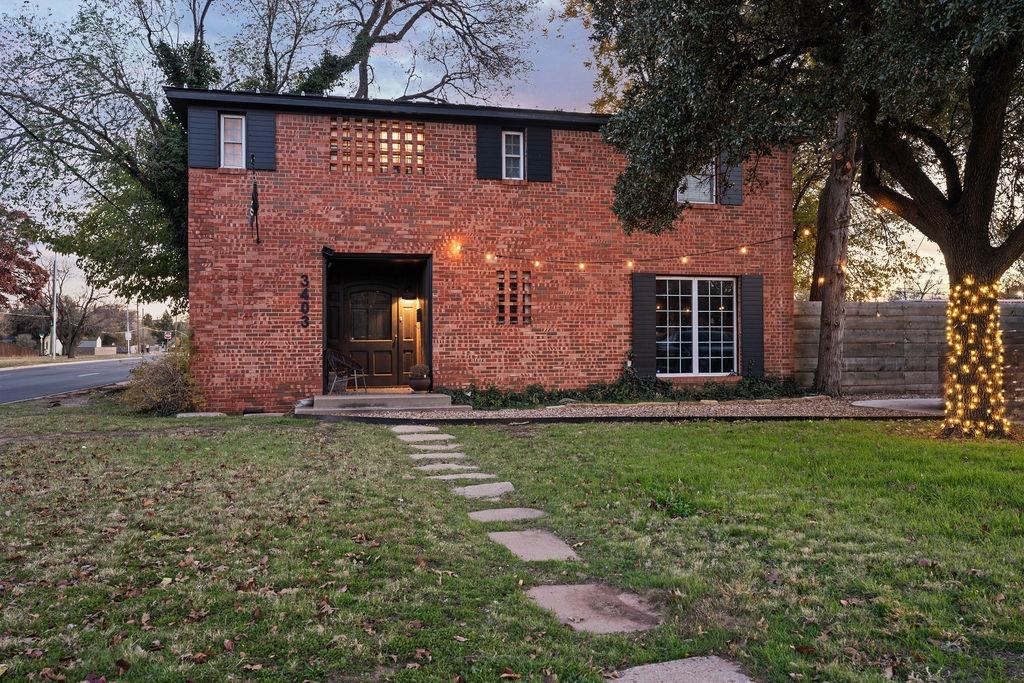 a front view of a house with garden