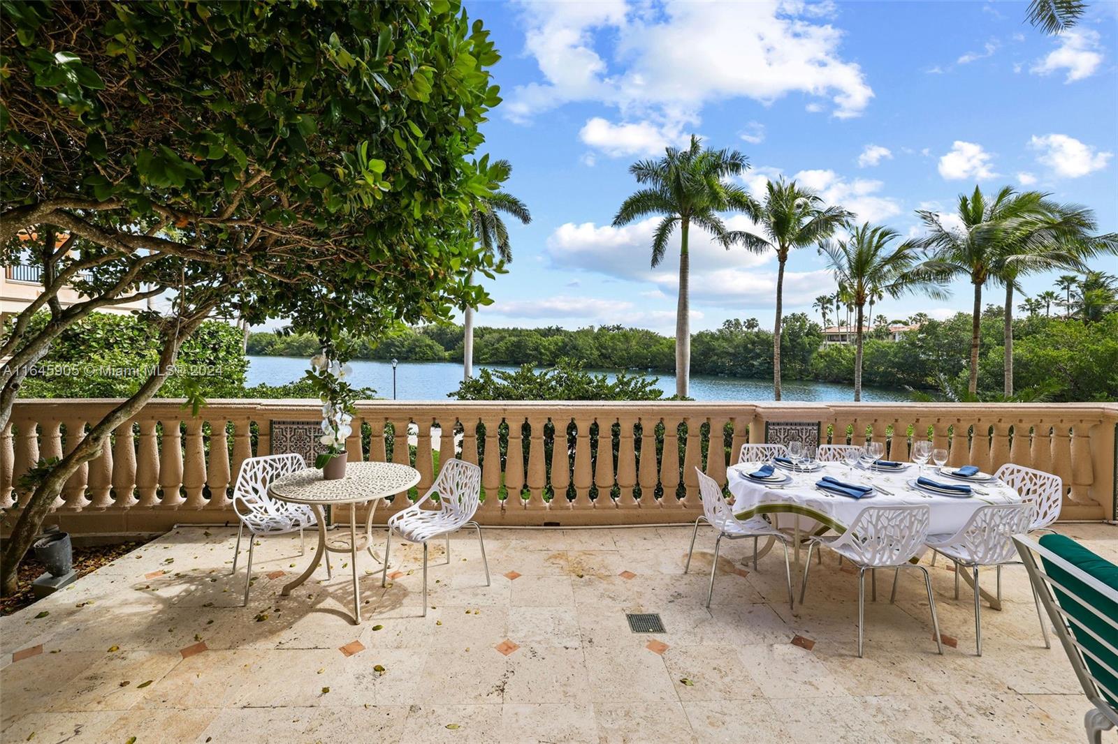 a view of a chairs and table in the patio