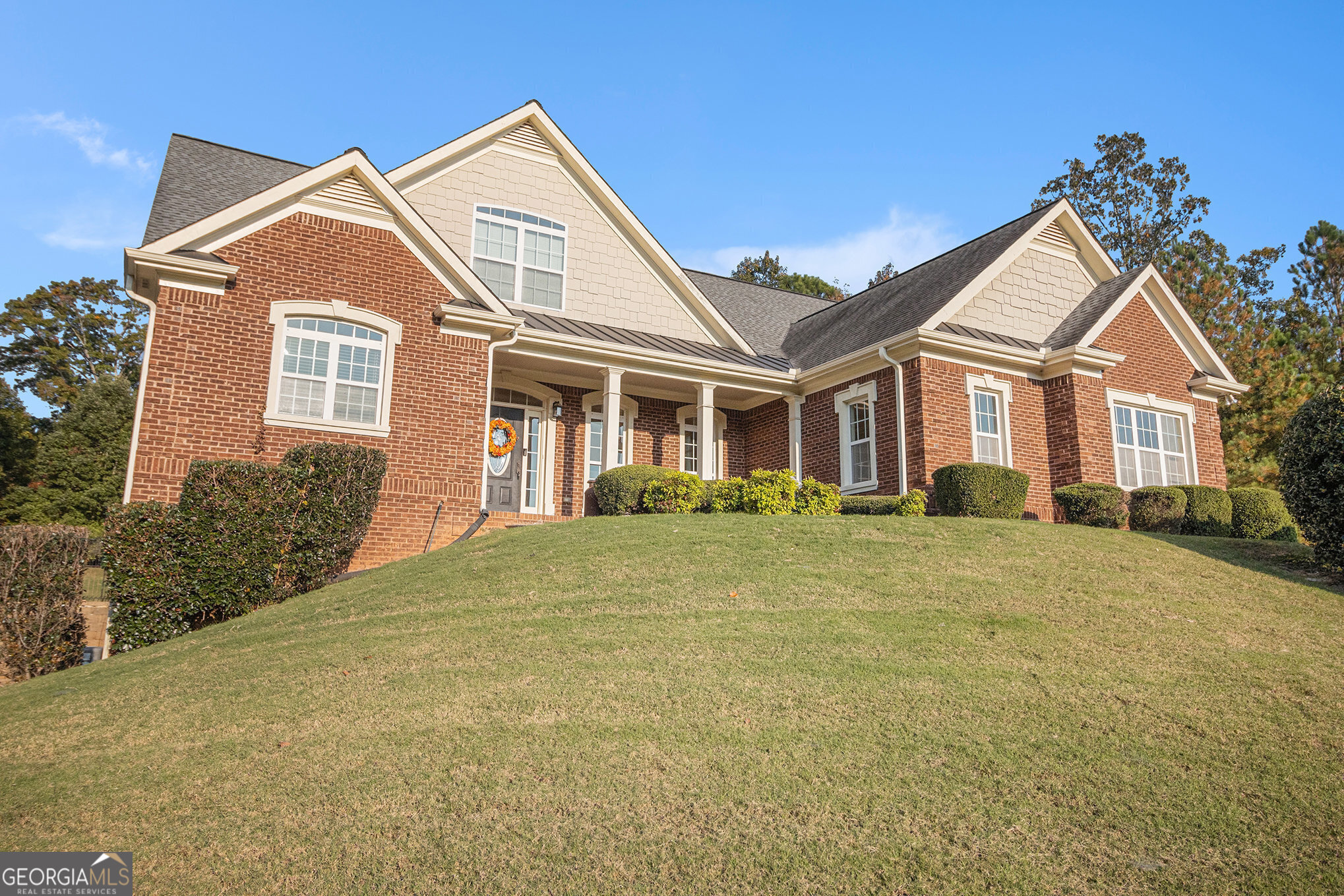 front view of a house with a yard