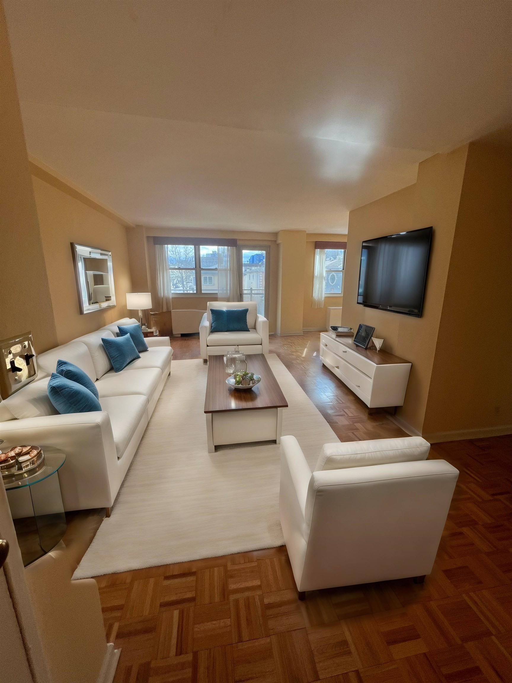 a living room with furniture and a flat screen tv