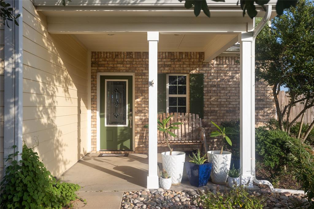 a view of a door of the house with outdoor seating