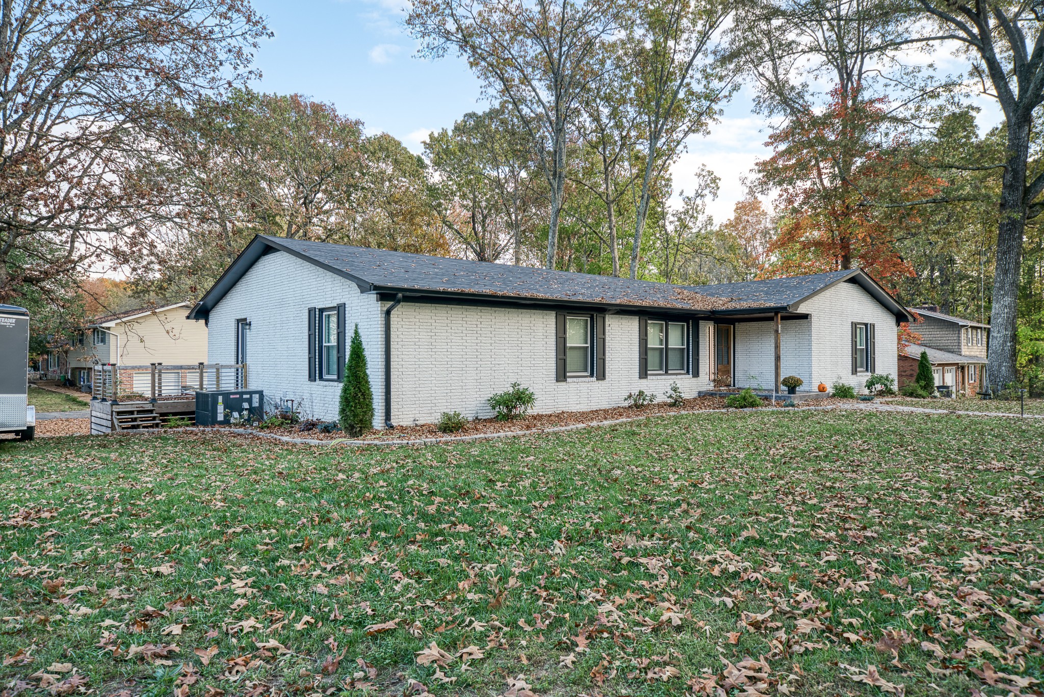 a front view of house with yard and green space