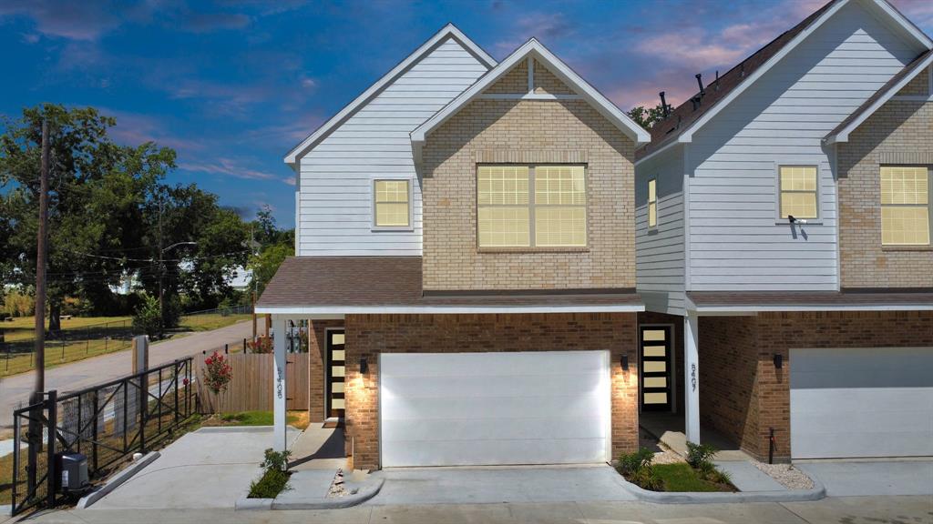 a front view of a house with a garage