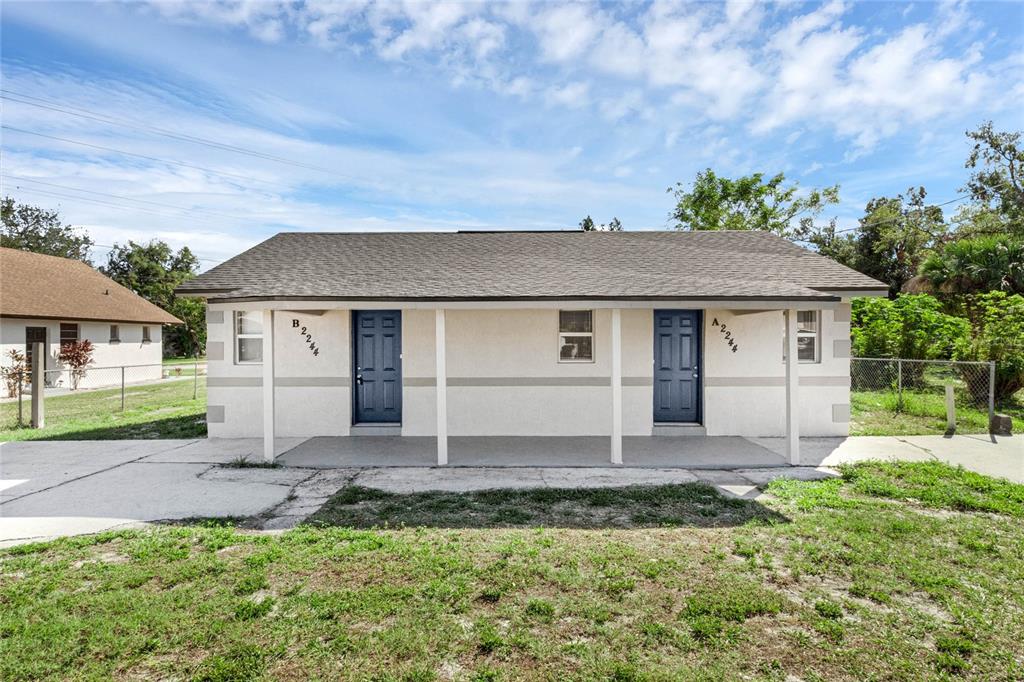 front view of a house with a yard