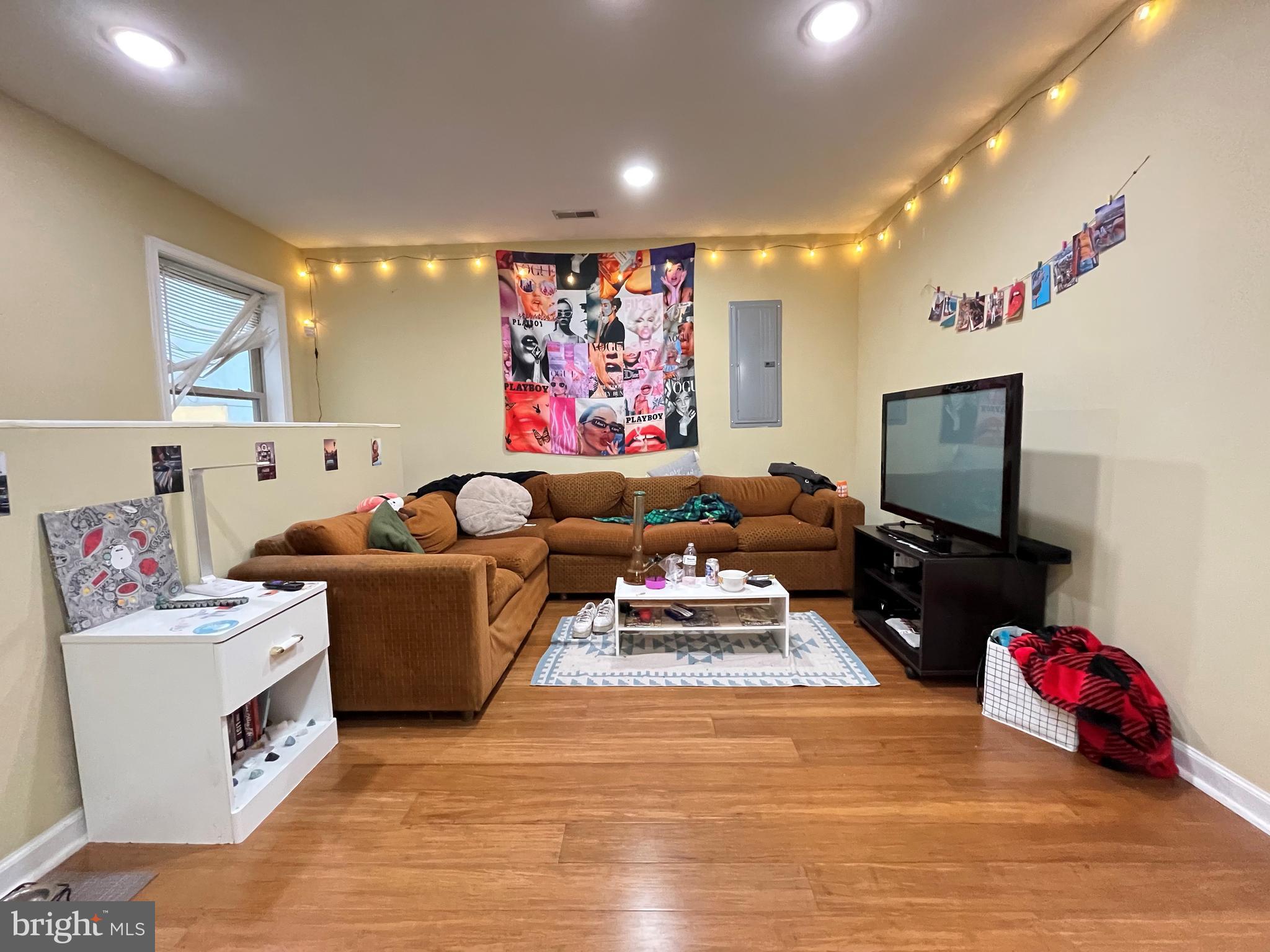 a living room with furniture and a flat screen tv