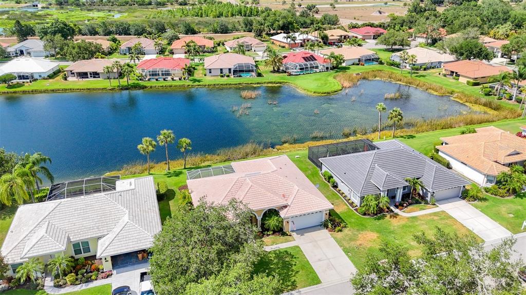 an aerial view of a house with a swimming pool yard and outdoor seating