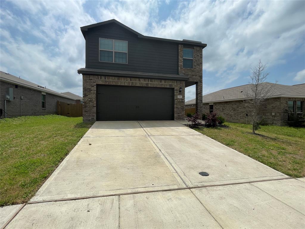 a house with yard in front of it