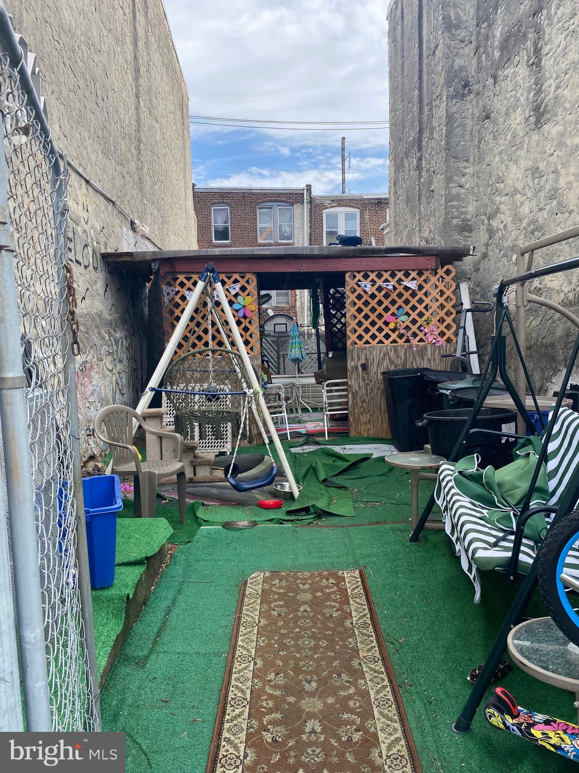 a view of a deck with a table and chairs