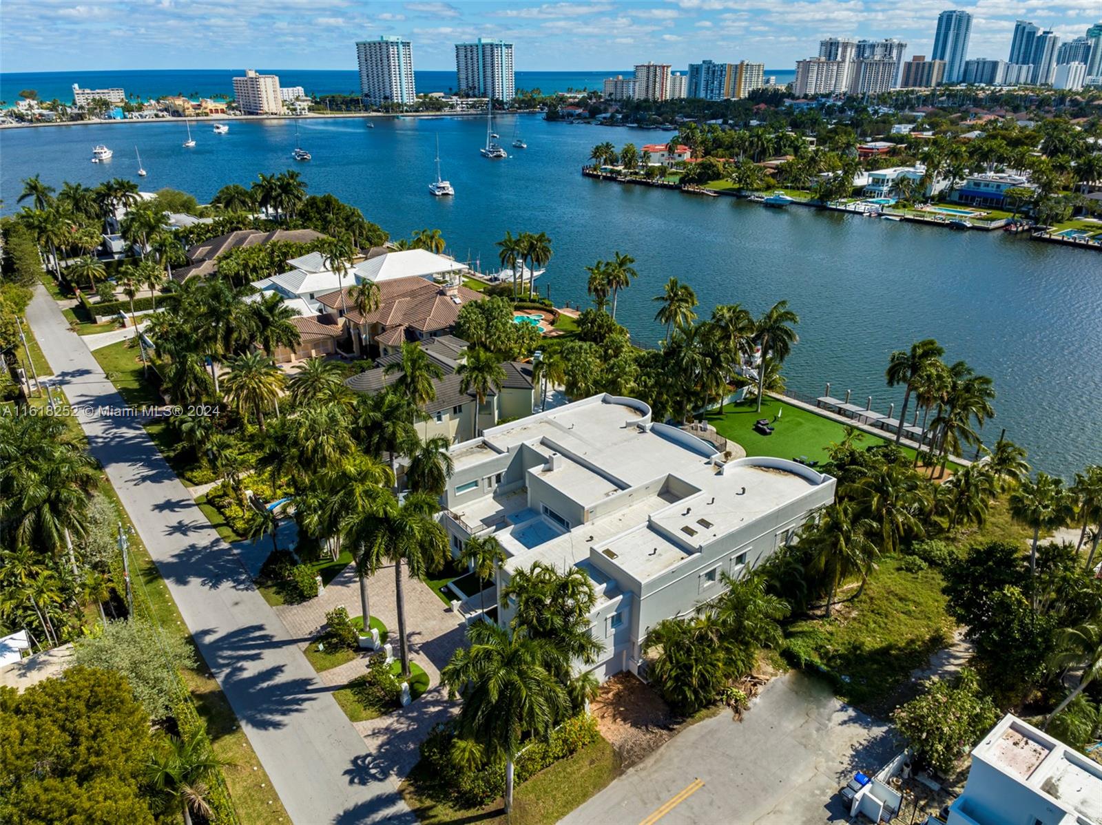 an aerial view of a house with a lake view