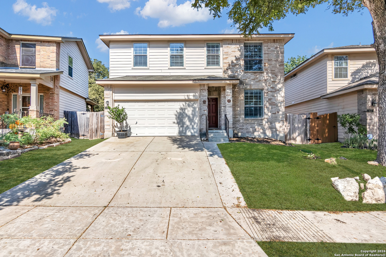 front view of a house with a yard