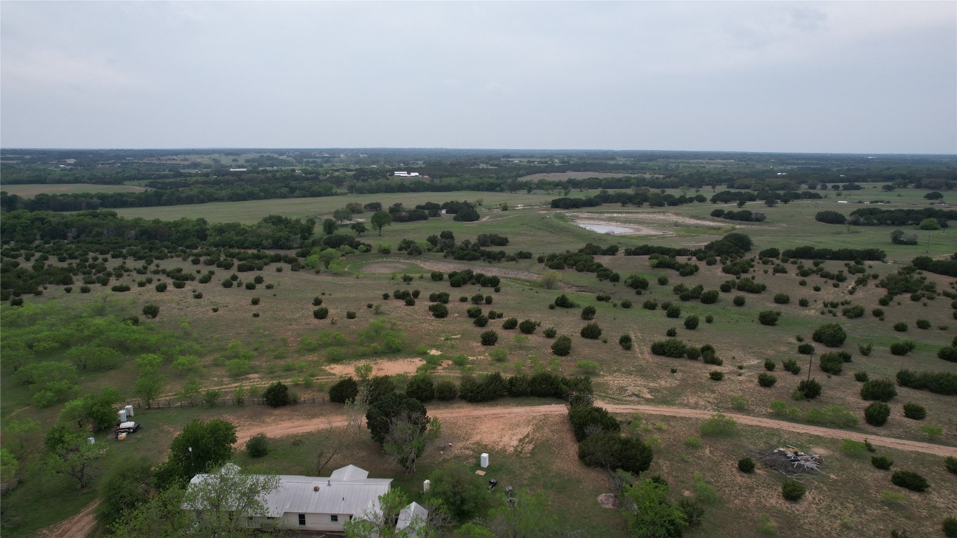 an aerial view of a houses with city view