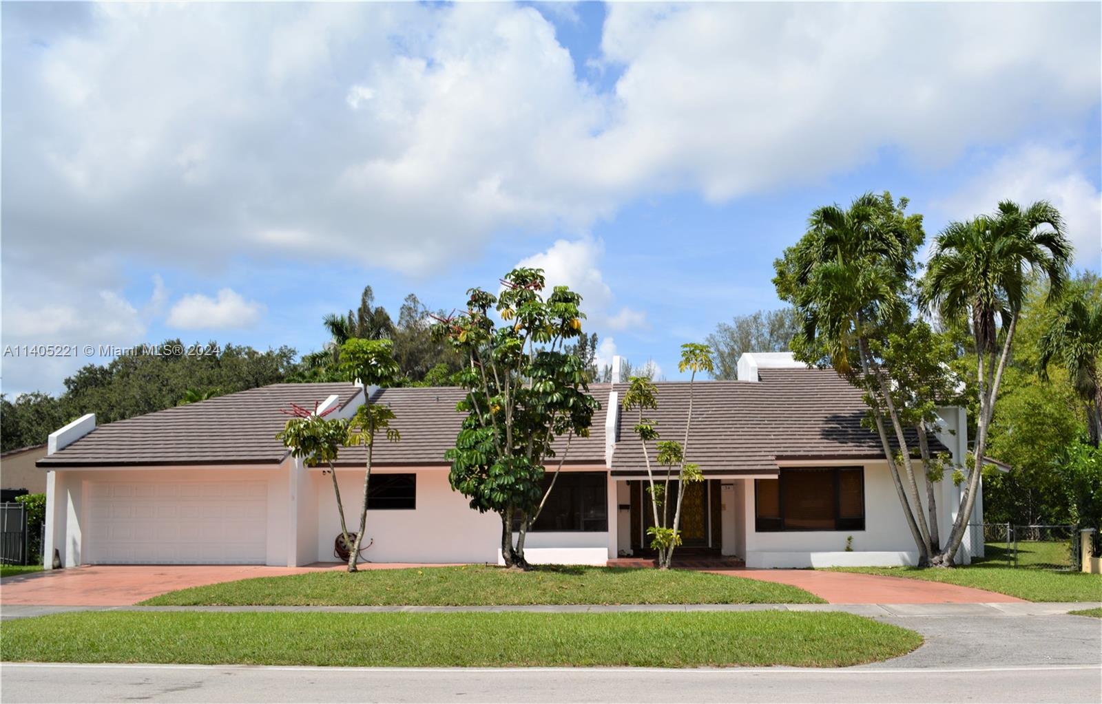 front view of a house with a yard