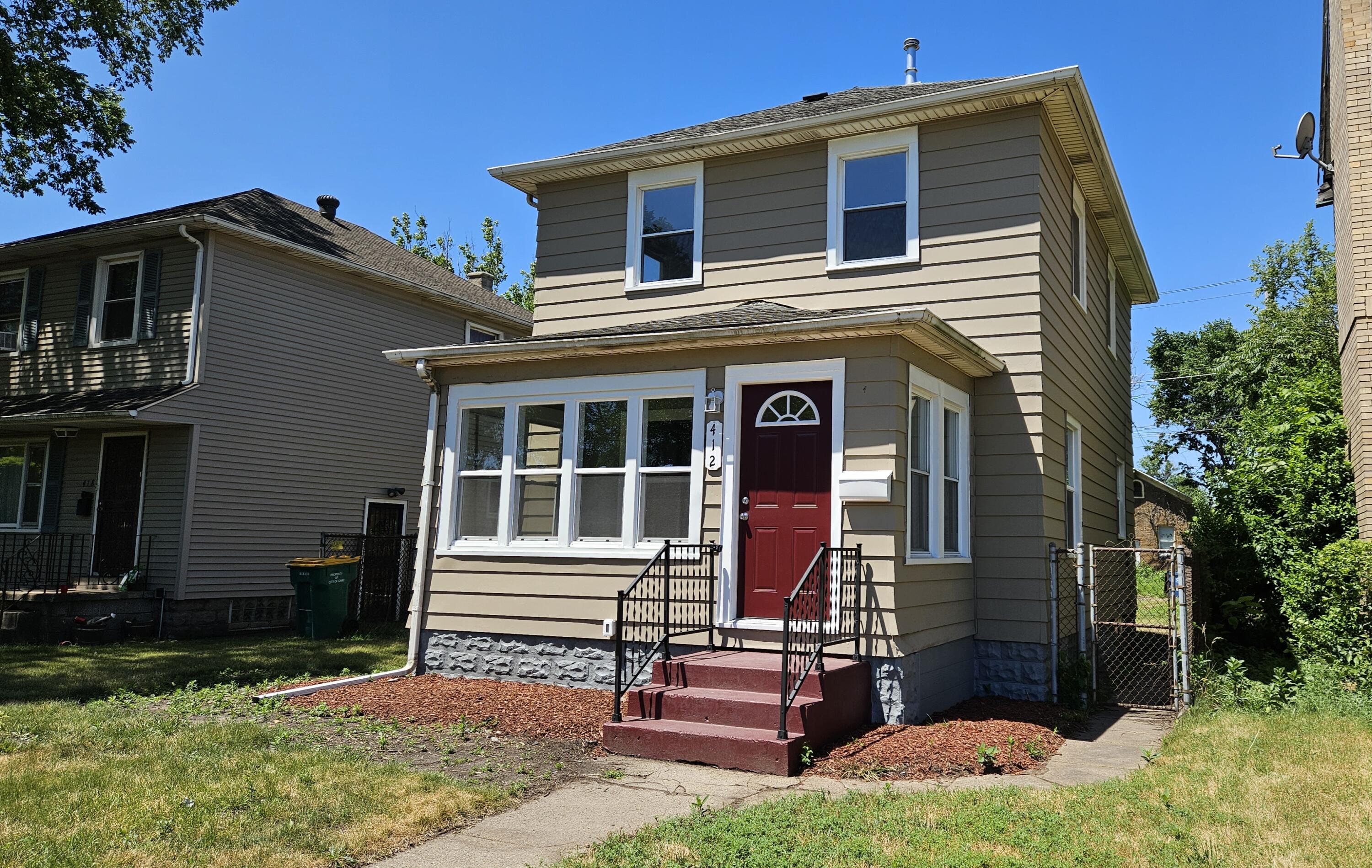 a view of house with yard