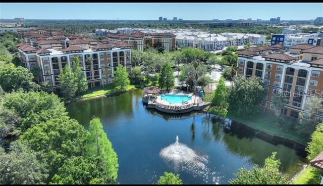 an aerial view of a house with a lake view