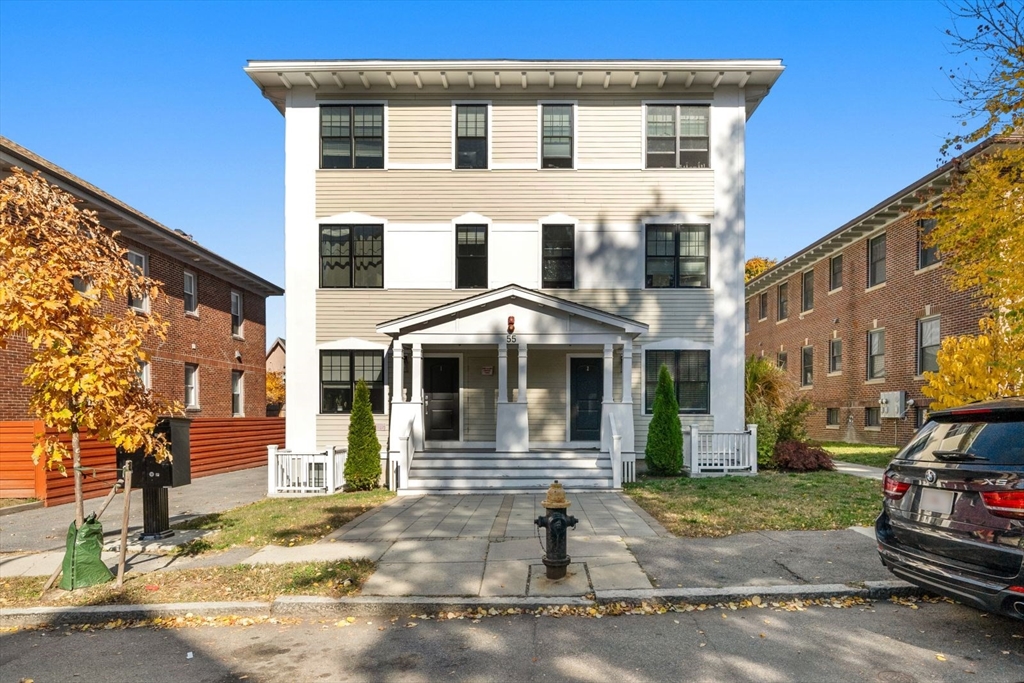 a front view of a house with a yard