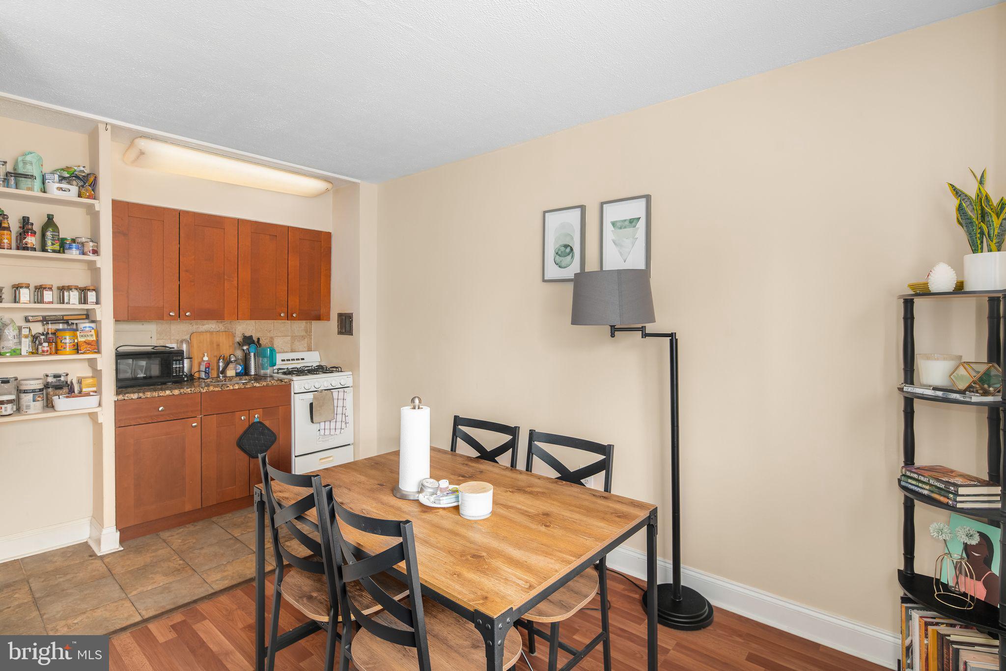 a dining room with furniture and wooden floor