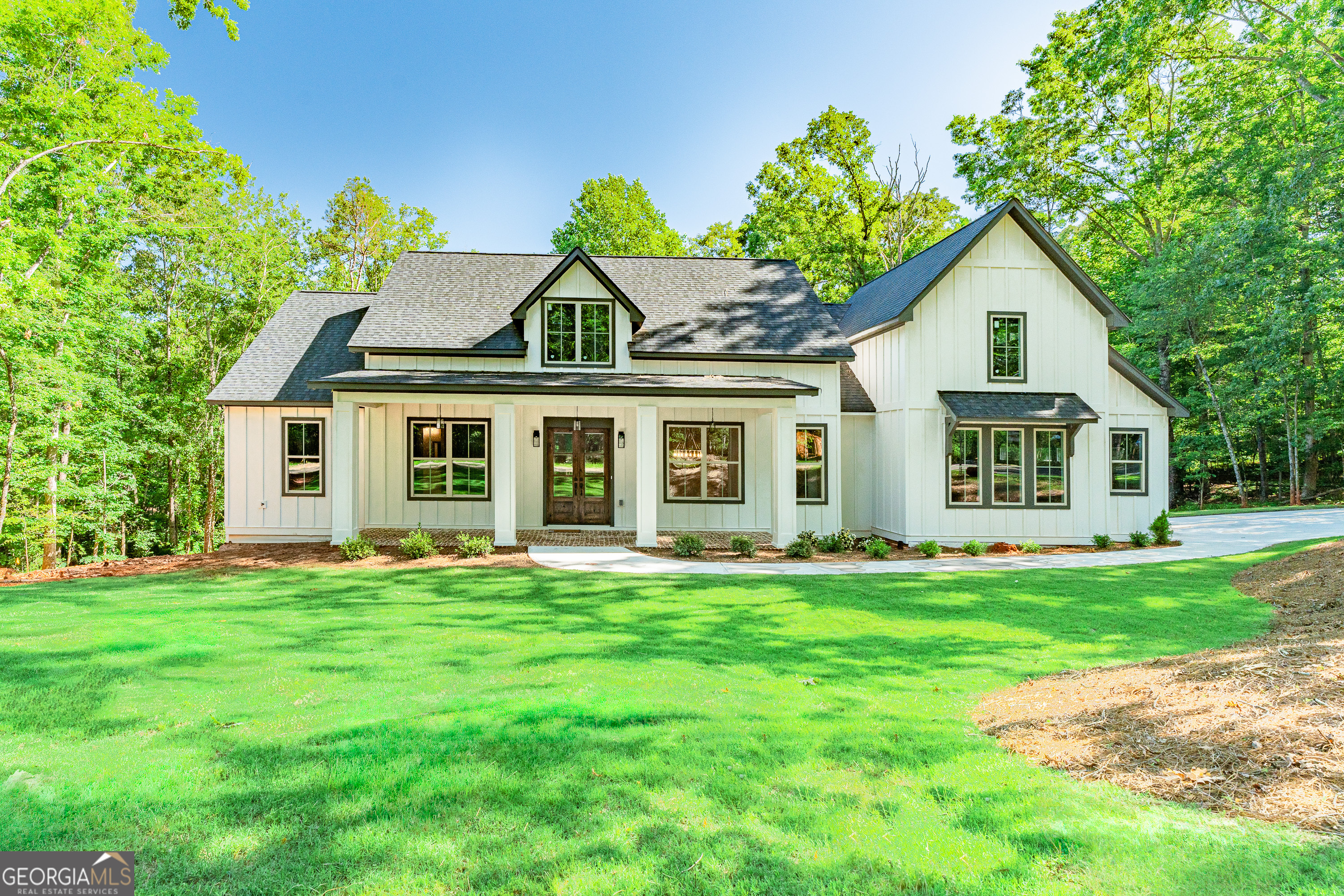 a front view of a house with a yard