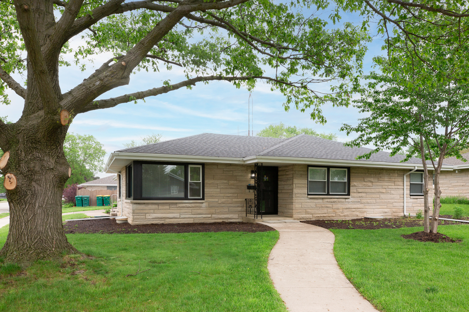 a front view of a house with yard