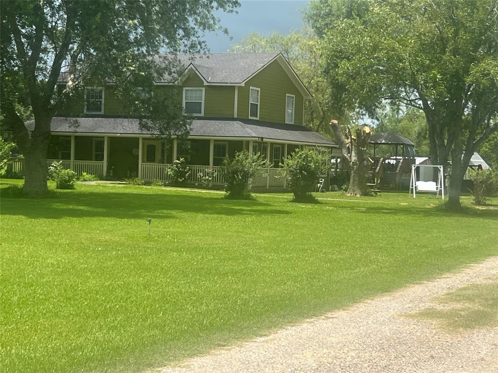 a front view of a building with a garden