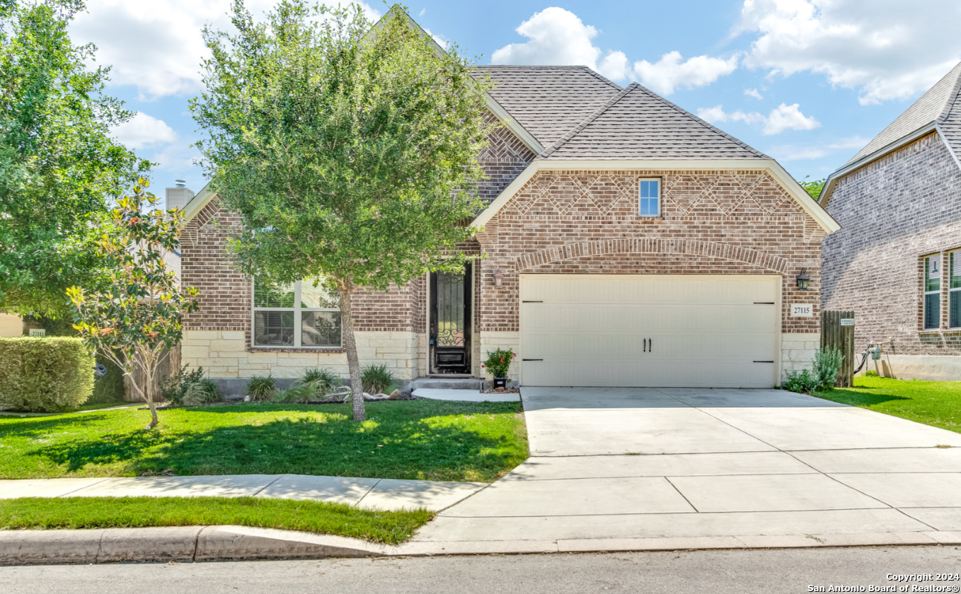 a view of a yard in front view of a house