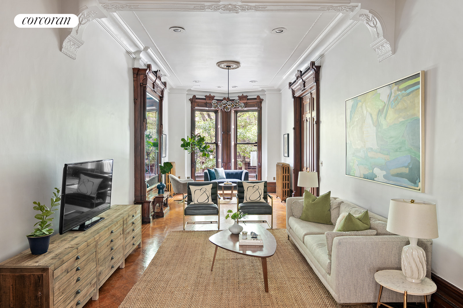 a living room with furniture fireplace and flat screen tv