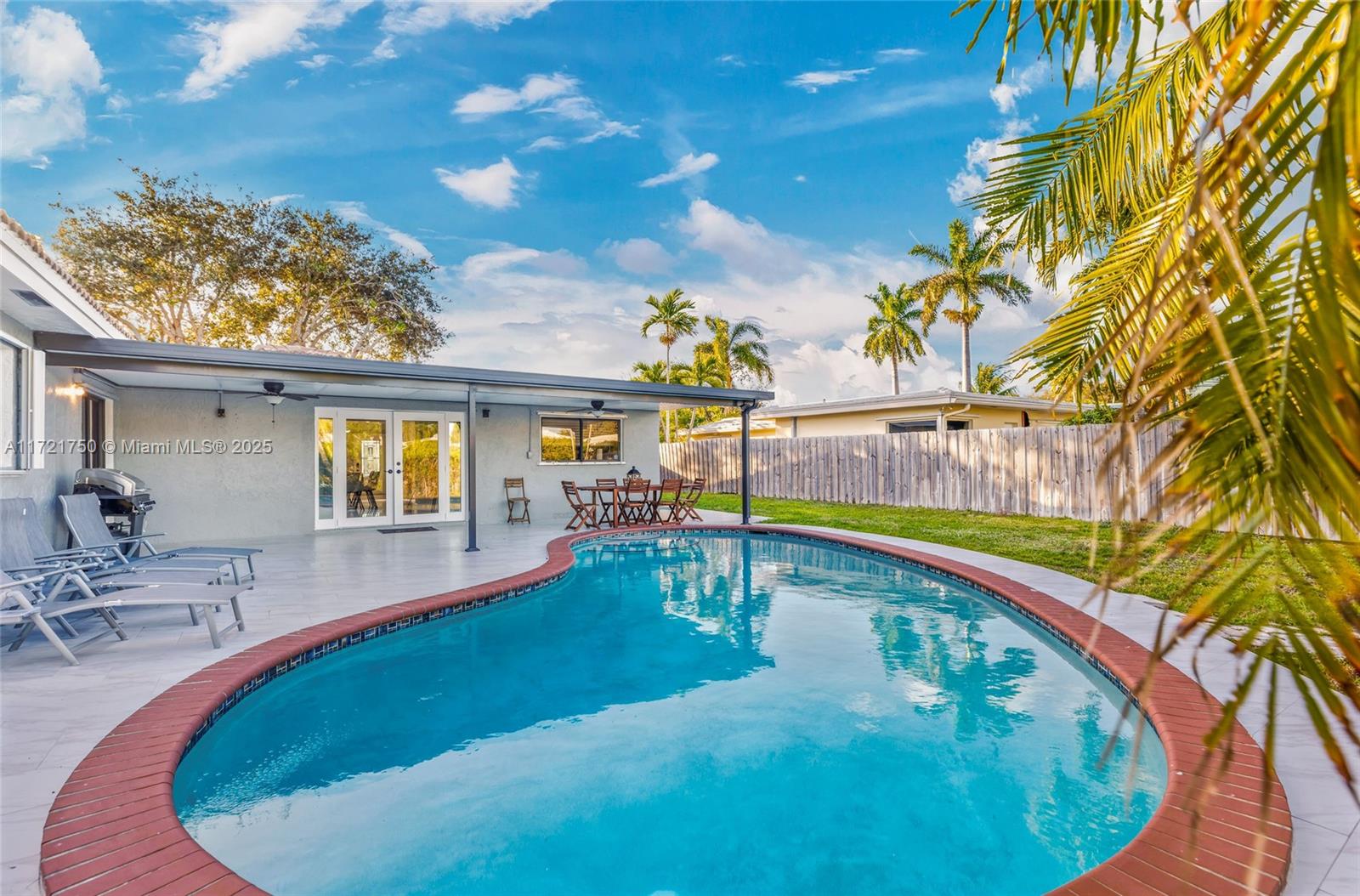 a view of a swimming pool with an outdoor seating