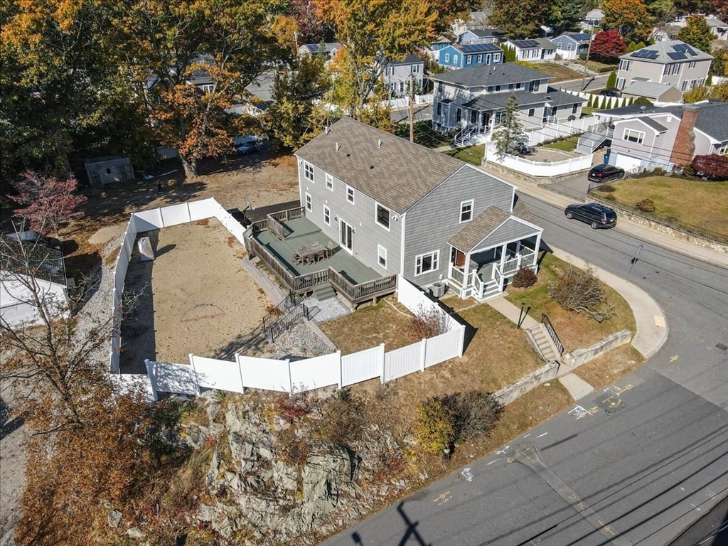 an aerial view of residential houses with outdoor space