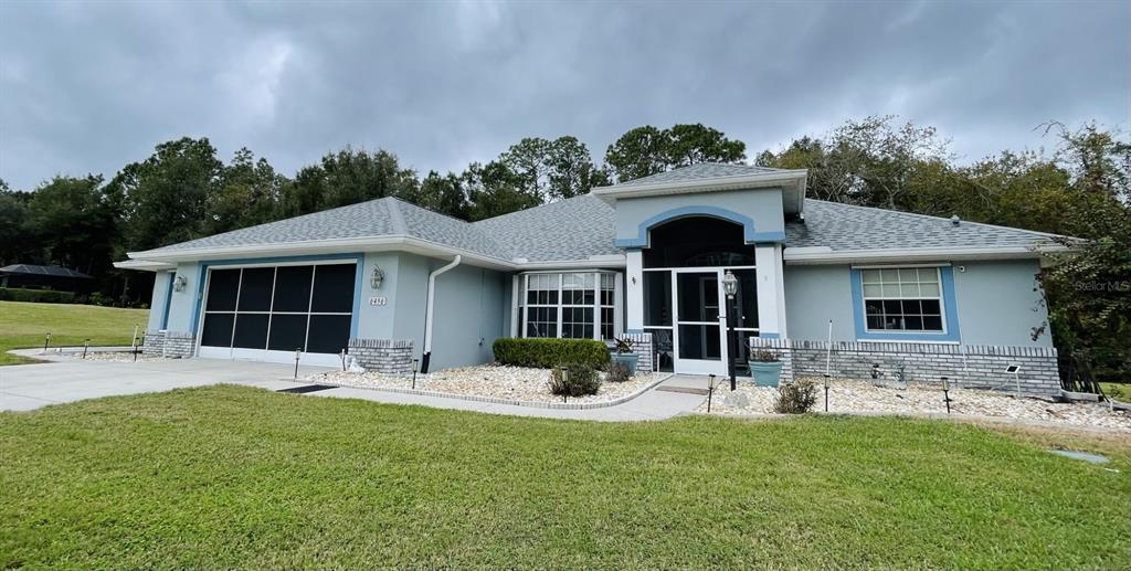 front view of a house with a yard