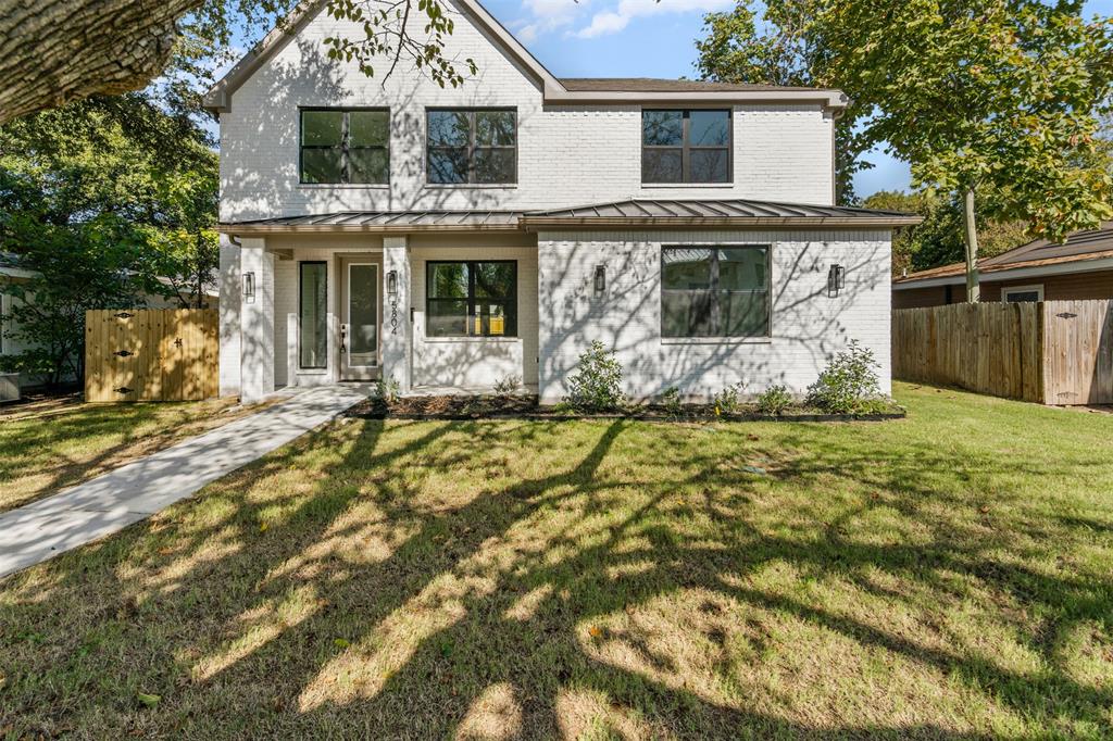 a front view of a house with yard